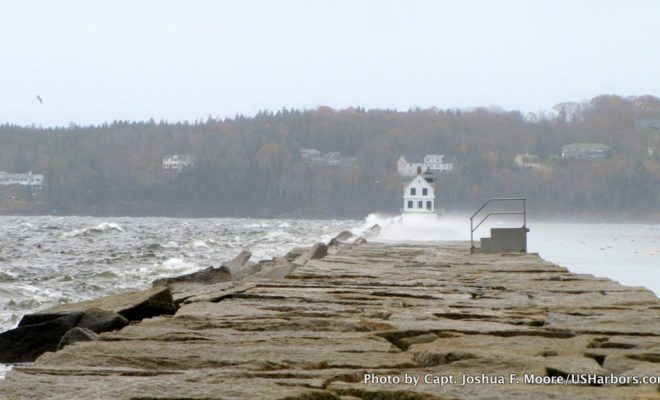 Just before the morning high tide, waves were crashing over the Rockland breakwater. With the storm surge, they overtopped it.