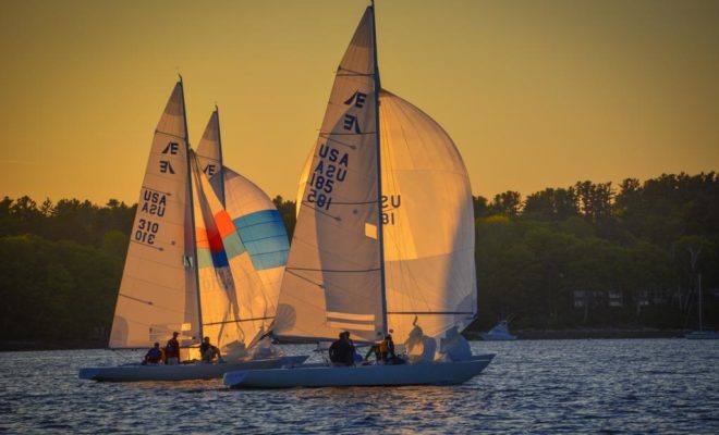 MEDUSA, sailed by Seth Sprague, and FUZZY LOGIC, sailed by Rich Hubbell, cross the finish line.