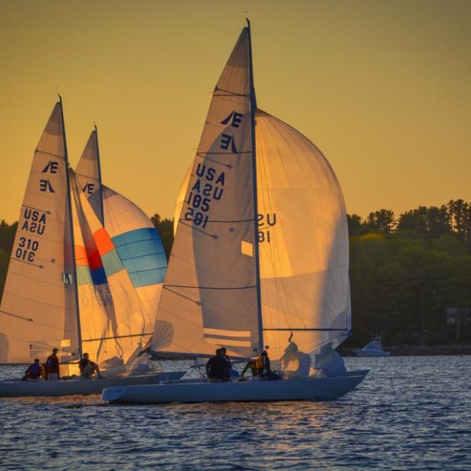 MEDUSA, sailed by Seth Sprague, and FUZZY LOGIC, sailed by Rich Hubbell, cross the finish line.