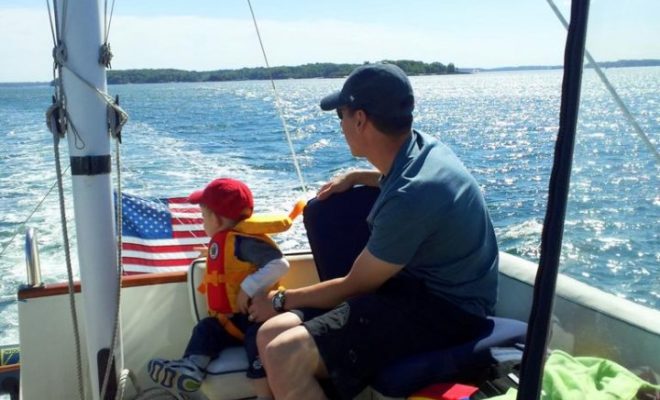 A son and a grandson enjoy a cruise to South Freeport aboard Contrails. The Air Force flag is always flying for this crew!