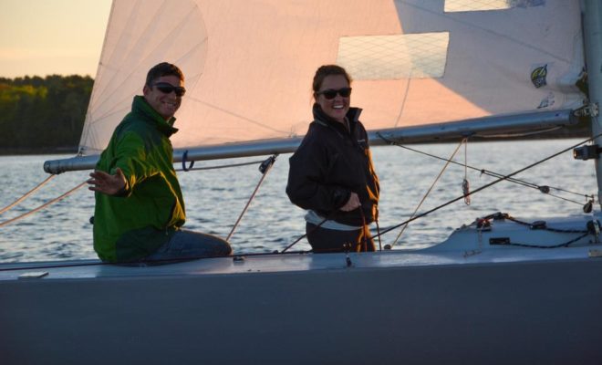 Tim Caven, owner of TOUCH OF GREY, and his crew check in with the race committee.