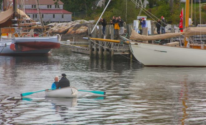 Camera shutters rapid fire as Gretchen and Michael enter the view finders of a photography class on Rockport Harbor.