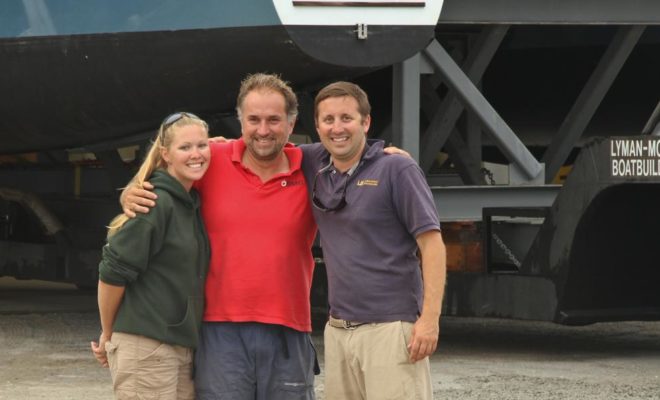 Drew Lyman, at far right, celebrates the start of another great project at Lyman-Morse Boatbuilding Co.
