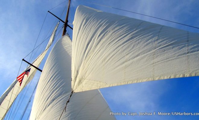 Drying out the sails aboard the classic Fife BELLE AVENTURE in Camden Harbor.