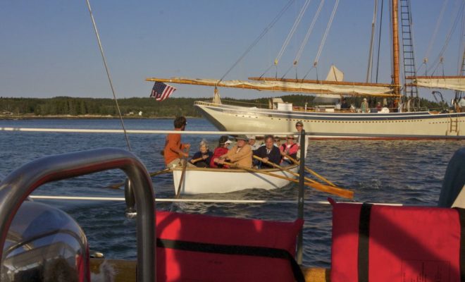 Schooner charterers quietly row past, and everyone - everyone, is smiling.