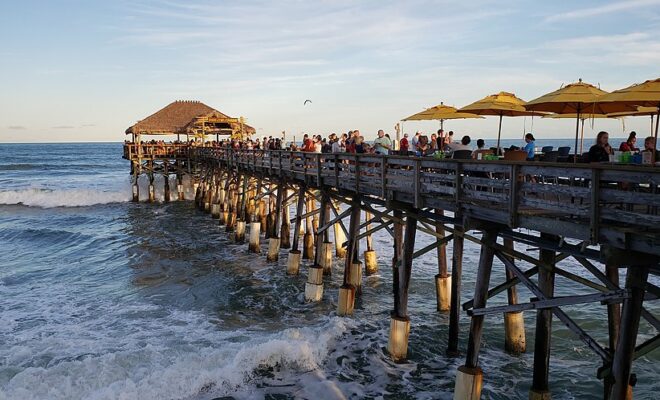 Cocoa Beach Pier, FL - Cathylaurenzi, CC BY-SA 4.0 , via Wikimedia Commons