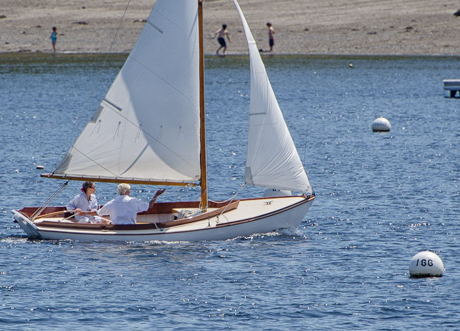 Buzzard's Bay 14 sails past Laite Beach in Camden, Maine.