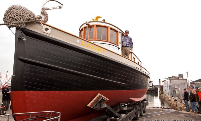 Capt. John Foss stands aboard the tugboat Cadet, which he rebuilt over a 10-year period.