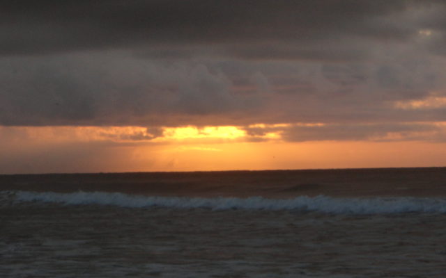 Sunrise and Clouds over the Beach