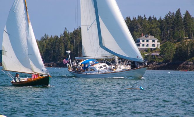 Sailing through East to West, two boats come through a 'hole' in the wind, and begin to power up.