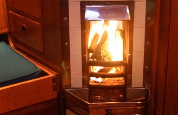 Fall sailing and an old fireplace on a boat go hand in hand.