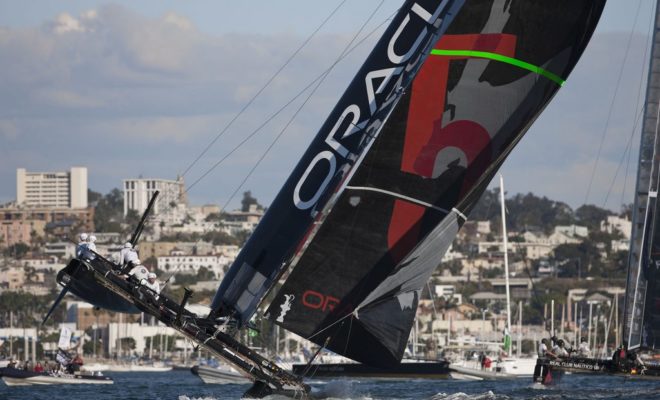Flying a hull on San Diego Bay. Photo by Gilles Martin-Raget/Americas Cup World Series