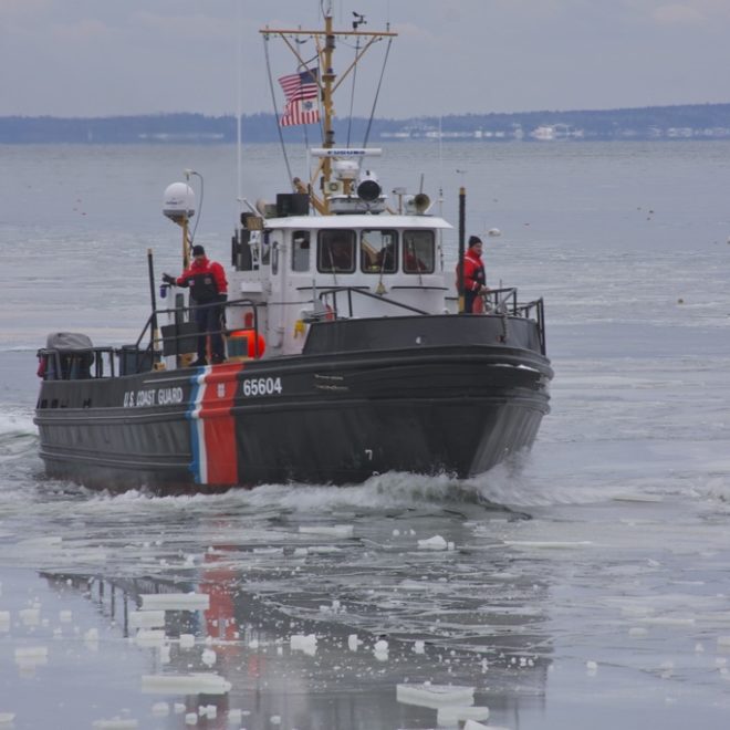 The ice breaker TACKLE out of Rockland Harbor enters ice-choked Rockport Harbor.