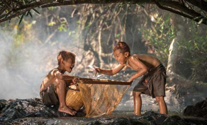 Southeast Asian fishermen preparing for nightly catch