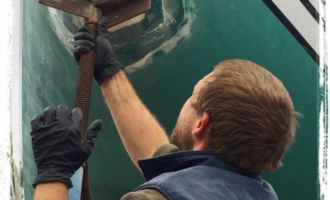 Matt securing the cutaway and new thruster hatch.