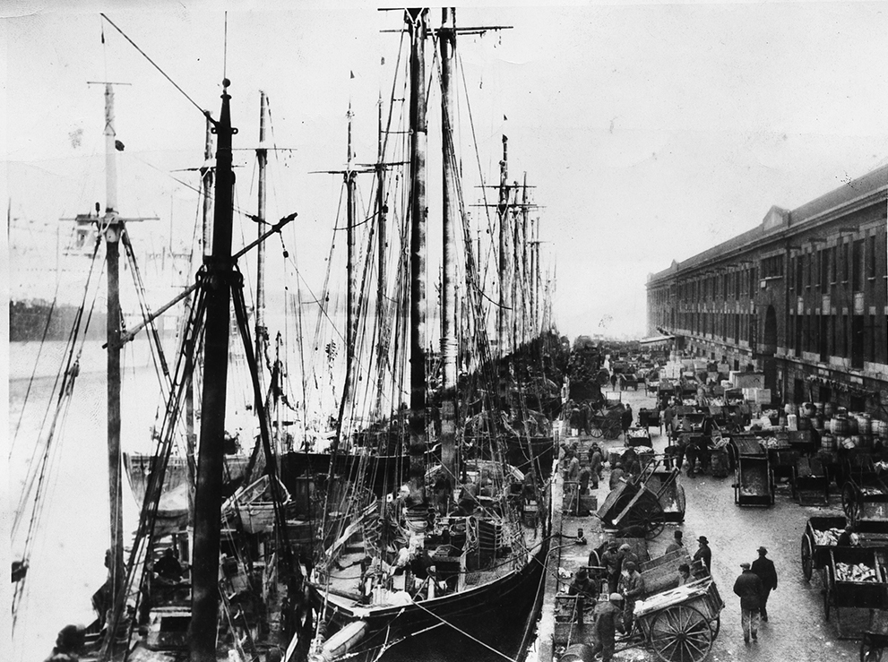 The Boston waterfront in the days before diesel engines and forklifts.