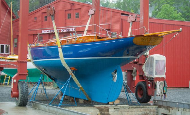 MYA, a 50' Concordia schooner built in 1940 at Duxbury Boat Yard, is re-christened 75 years later, in a new spring rain.