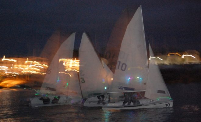 Racing with the lights of Rockland in the background. Photo by Michael O'Neil
