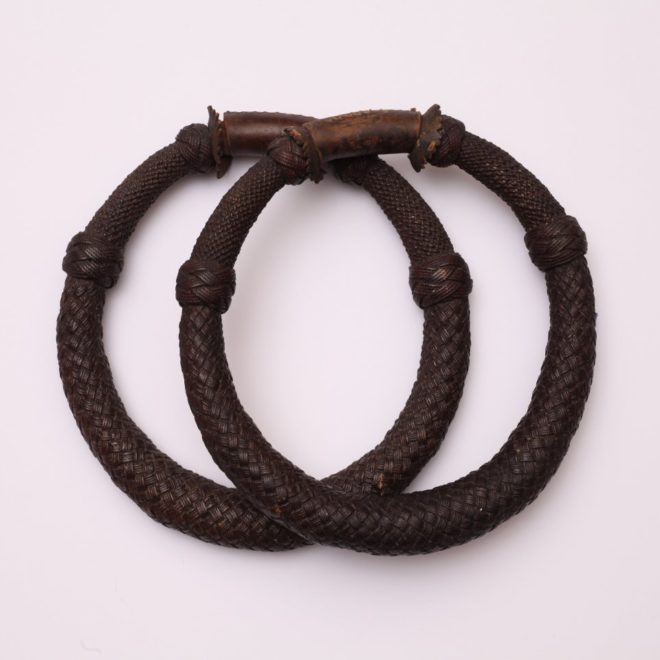 Pair of seaman‚Äôs chest beckets. Twine, marline, leather, shellac, late 19th century. New Bedford Whaling Museum Collection.