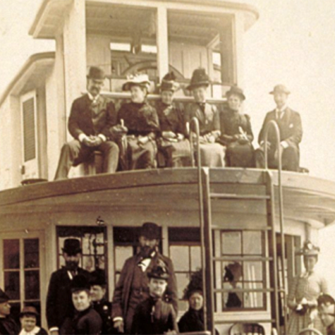 Passengers on Bow of Steamboat