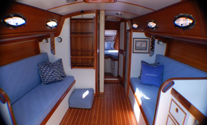 This salon features a cool palette highlighted by Herreshoff-style bulkheads. COURTESY ONBOARD INTERIORS