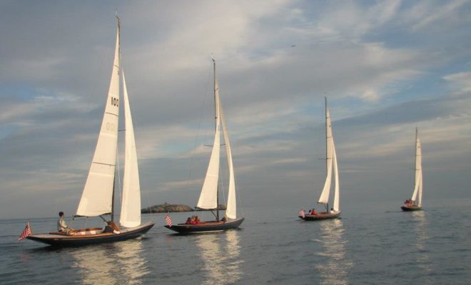 Even with practically no breeze, the Marblehead High School Sailing Team had a spirited race. Photo by Dave Kinney.