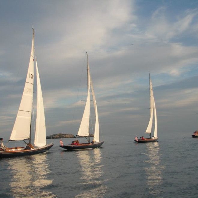 Even with practically no breeze, the Marblehead High School Sailing Team had a spirited race. Photo by Dave Kinney.