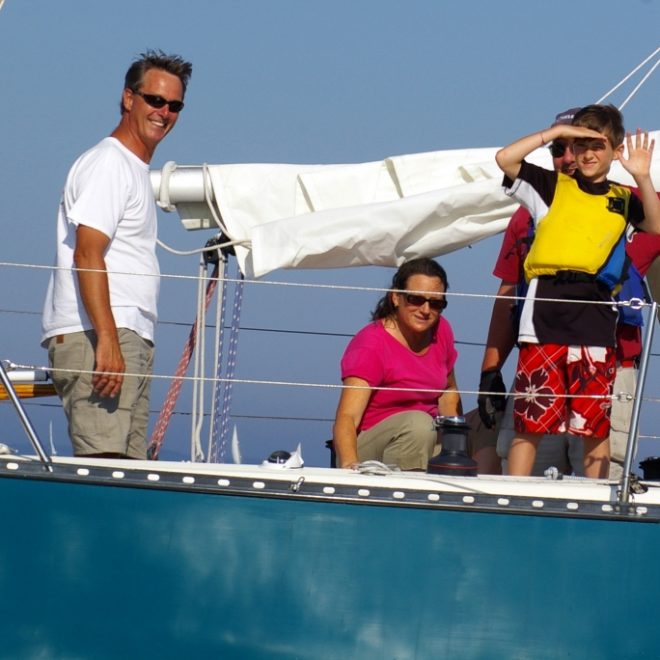 RCS sailor Andy Bird, in yellow, on Doug Pope's Walkabout.
