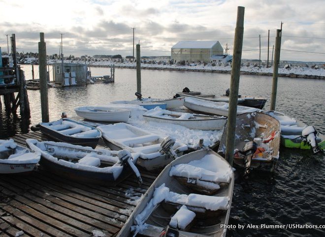 Snow-covered skiffs on Jonesport's working waterfront.