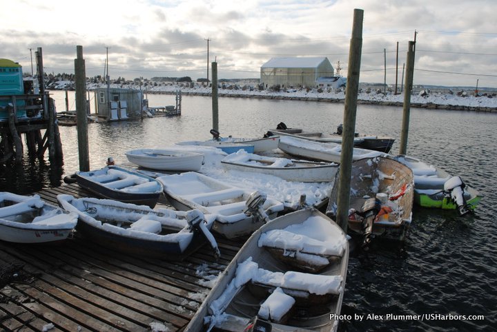 Snow-covered skiffs on Jonesport's working waterfront.