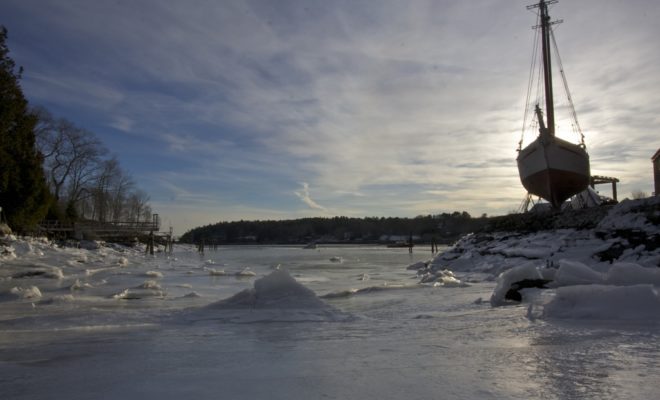 The ebbing tide left a mantle of ice to explore that settled taffy-like on the bottom of a cove. Sliding my way down the icy...