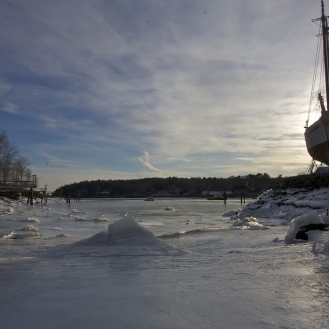 The ebbing tide left a mantle of ice to explore that settled taffy-like on the bottom of a cove. Sliding my way down the icy...
