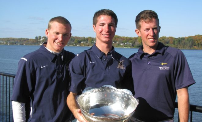 Former RCS sailor Dillon Rossiter holding college championship JFK Cup with Naval Academy crew.