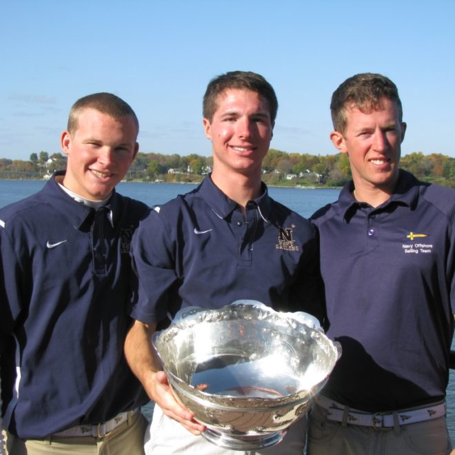 Former RCS sailor Dillon Rossiter holding college championship JFK Cup with Naval Academy crew.