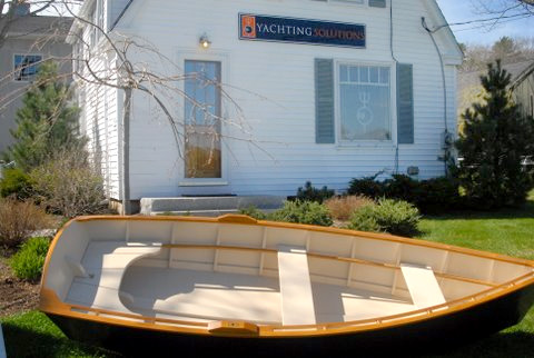A student built skiff in front of Yachting Solutions Rockport offices