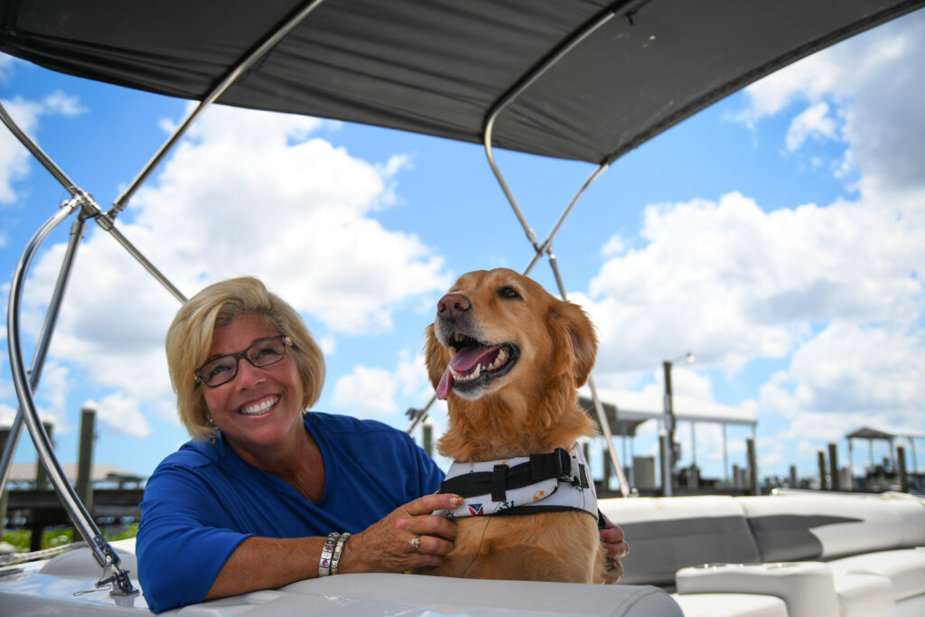 Lisa "The Boatanista" Almeida and her dog Matey.