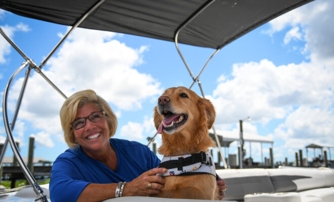 Lisa "The Boatanista" Almeida and her dog Matey.