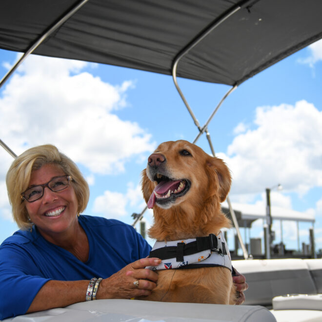 Lisa "The Boatanista" Almeida and her dog Matey.