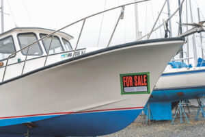 Downeast style boat on jackstands for sale in Maryland.