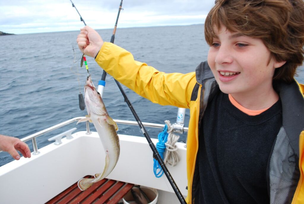 Young boy fishing.