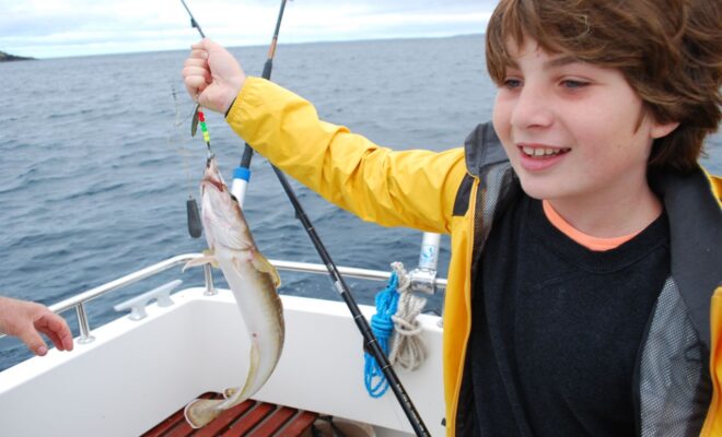 Young boy fishing.