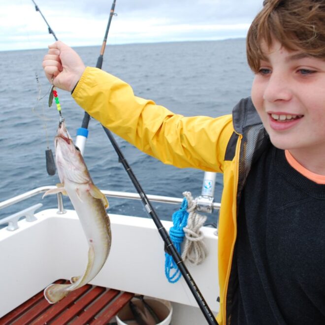 Young boy fishing.