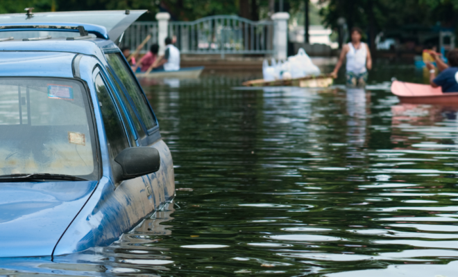 Car stranded by flood. Image royalty free from Canva.com