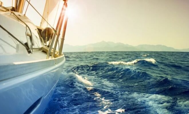 Yacht Sailing Downwind at Sunset