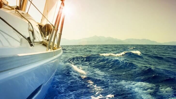 Yacht Sailing Downwind at Sunset