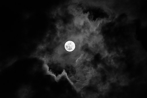 Katsiaryna Naliuka, CC BY-SA 4.0 <https://creativecommons.org/licenses/by-sa/4.0>, 512px-Full_moon_in_the_clouds via Wikimedia Commons