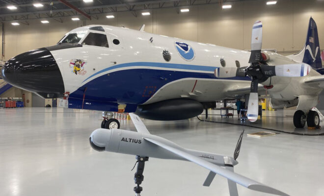 Altius demonstration model with Hurricane Hunter, NOAA WP-3D Orion “Miss Piggy,” at NOAA’s Aircraft Operations Center in Lakeland, FL during the second UAS flight test window on May 25, 2022. Photo Credit: NOAA/AOC Altius demonstration model with Hurricane Hunter, NOAA WP-3D Orion “Miss Piggy,” at NOAA’s Aircraft Operations Center in Lakeland, FL during the second UAS flight test window on May 25, 2022. Photo Credit: NOAA/AOC