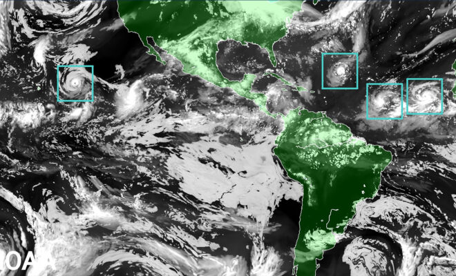 The Hurricane Analysis and Forecast System (HAFS) “moving nest" Model. Global map showcasing land mass in green and water in black, clouds in white and tropical storms outlined in a green boxes representing the moving nest model. (Image credit: NOAA)