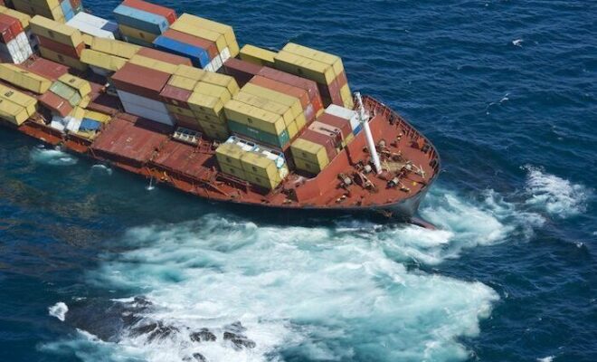 Grounded ship Rena on the Astrolabe reef by Splash247.