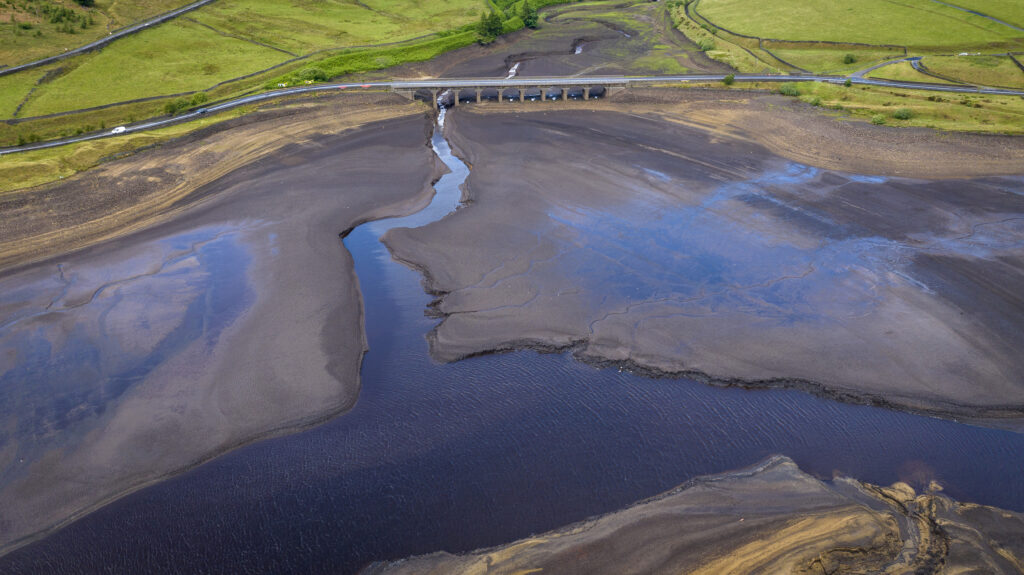 July 3, 2023: An aerial view of low water levels at Woodhead Reservoir in Glossop, England, after the United Kingdom sweltered through its hottest June on record. 2023 was the world’s warmest year on record, beating the next warmest year (2016) by a record-setting margin of 0.23 of a degree F (0.13 of a degree C). (Image credit: Christopher Furlong/Getty Images)